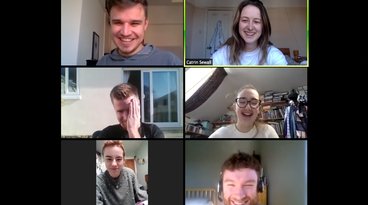 Six people laughing on a video call